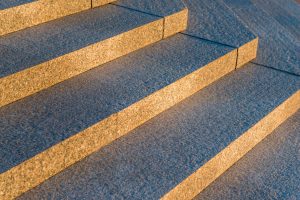 gray granite stairs in a city closeup